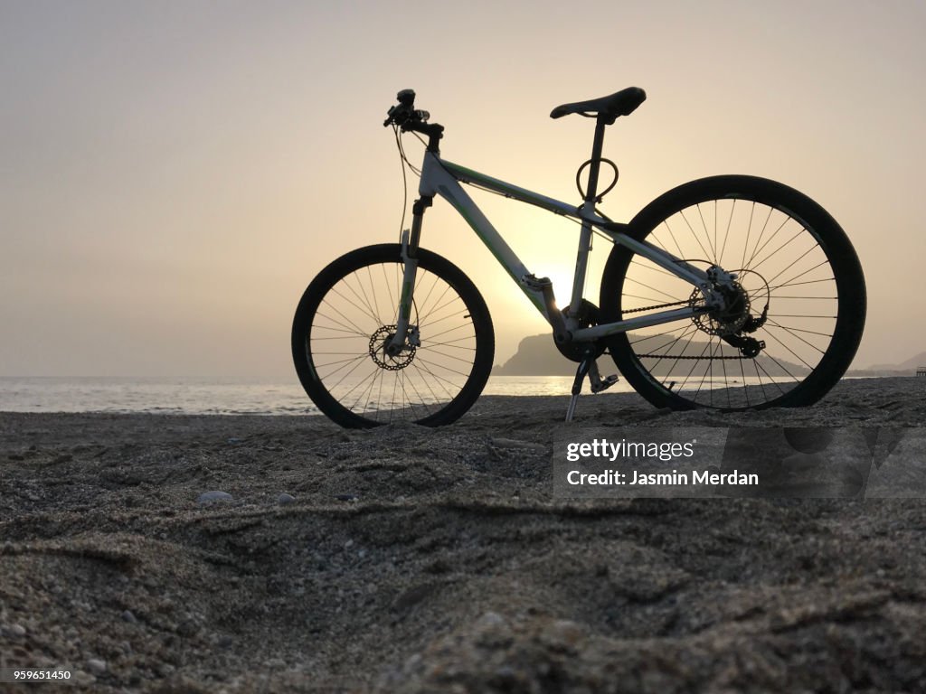 Bike on sunset beach