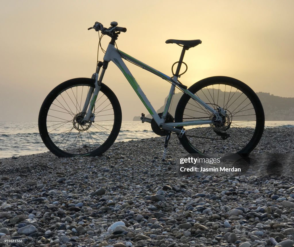 Bike on sunset beach