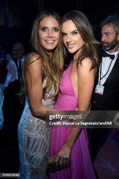 Heidi Klum and Alessandra Ambrosio attend the amfAR Gala Cannes 2018 dinner at Hotel du Cap-Eden-Roc on May 17, 2018 in Cap d'Antibes, France.