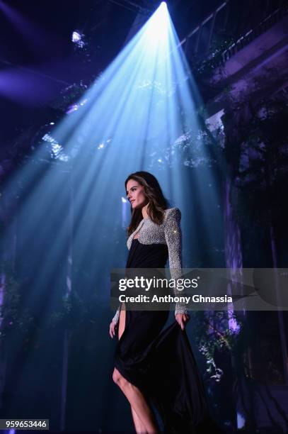 Alessandra Ambrosio wearing Balmain walks the runway at the amfAR Gala Cannes 2018 at Hotel du Cap-Eden-Roc on May 17, 2018 in Cap d'Antibes, France.