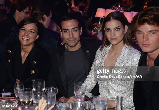 Michelle Rodriguez, Mohammed Al Turki, Barbara Palvin and Jordan Barret attend the amfAR Gala Cannes 2018 dinner at Hotel du Cap-Eden-Roc on May 17,...