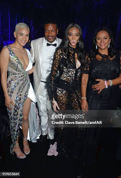 Mette Towley, Chris Tucker, Winnie Harlow and Isabel dos Santos attend the amfAR Gala Cannes 2018 dinner at Hotel du Cap-Eden-Roc on May 17, 2018 in...