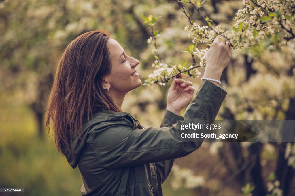 Pretty woman in the orchard