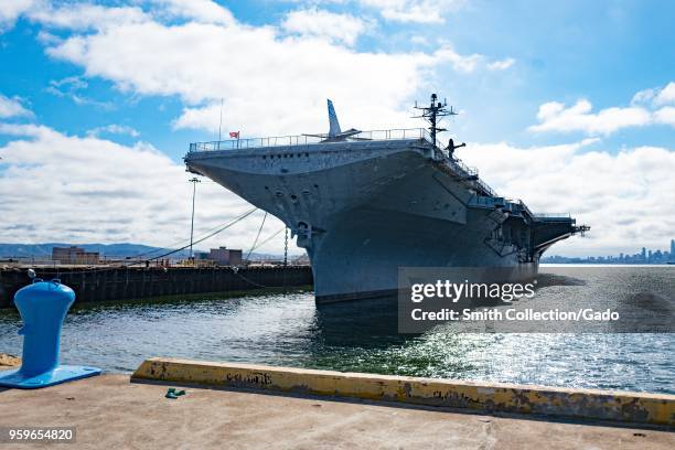 The USS Hornet, an aircraft carrier converted into a maritime museum, is visible moored on the West end of the Alameda, California, under a dramatic...