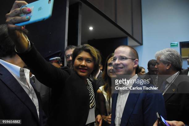Ricardo Anaya, 'Mexico al Frente' Coalition presidential candidate, poses for a selfie with a supporter during a conference as part of the...