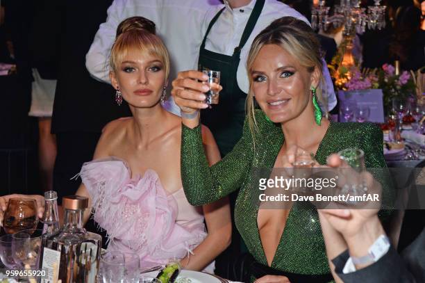 Kristina Romanova and Masha Markova Hanson attend the amfAR Gala Cannes 2018 dinner at Hotel du Cap-Eden-Roc on May 17, 2018 in Cap d'Antibes, France.
