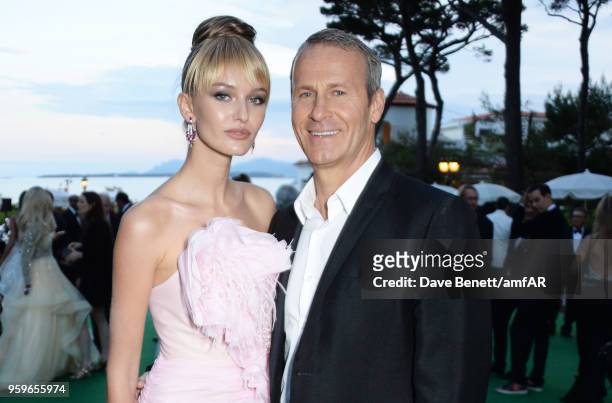 Kristina Romanova and Vladislav Doronin attend the amfAR Gala Cannes 2018 dinner at Hotel du Cap-Eden-Roc on May 17, 2018 in Cap d'Antibes, France.
