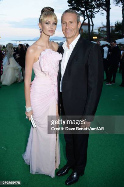 Kristina Romanova and Vladislav Doronin attend the amfAR Gala Cannes 2018 dinner at Hotel du Cap-Eden-Roc on May 17, 2018 in Cap d'Antibes, France.