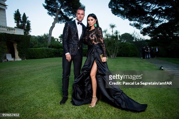 Philipp Plein and Morgan Osman pose for portraits at the amfAR Gala Cannes 2018 cocktail at Hotel du Cap-Eden-Roc on May 17, 2018 in Cap d'Antibes,...