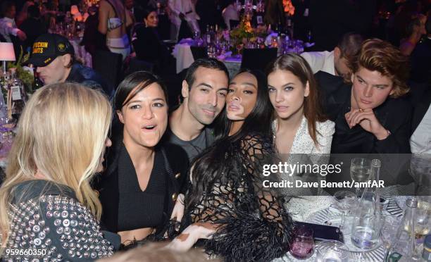 Michelle Rodriguez, Mohammed Al Turki, Winnie Harlow, Barbara Palvin and Jordan Barrett attend the amfAR Gala Cannes 2018 dinner at Hotel du...