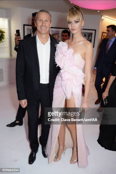 Vladislav Doronin and Kristina Romanova attend the amfAR Gala Cannes 2018 dinner at Hotel du Cap-Eden-Roc on May 17, 2018 in Cap d'Antibes, France.