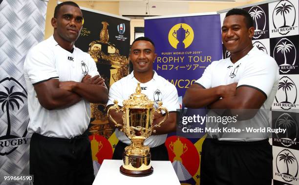 Members of the Fiji national rugby team pose with the Webb Ellis Cup during the Rugby World Cup 2019 Trophy Tour visit to the Fiji Rugby Union...