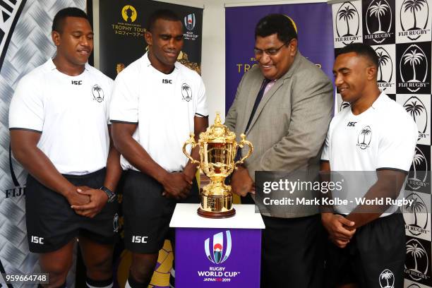 Members of the Fiji national rugby team and Chief Executive Officer of the Fiji Rugby Union John Masi O'Connor pose with the Webb Ellis Cup during...