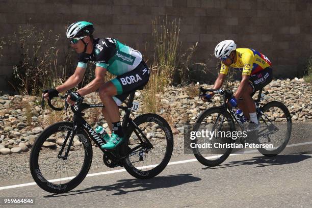 Maciej Bodnar of Poland riding for Team Bora - Hansgrohe and Jhonatan Manuel Narvaez Prado of Ecuador riding for Team Quick-Step Floors ride during...