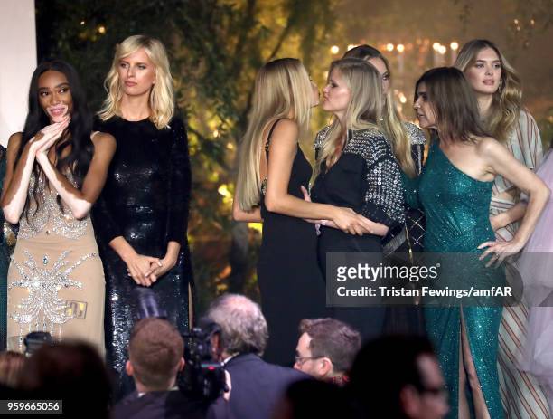 Winnie Harlow, Karolina Kurkova, Natasha Poly, Lara Stone, Hannah Ferguson, Carine Roitfeld and Megan Williams on stage at the amfAR Gala Cannes 2018...