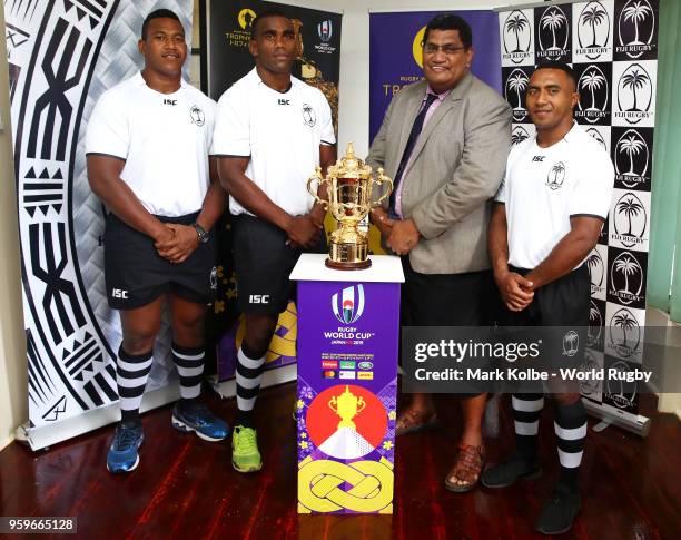 Members of the Fiji national rugby team and Chief Executive Officer of the Fiji Rugby Union John Masi O'Connor pose with the Webb Ellis Cup during...