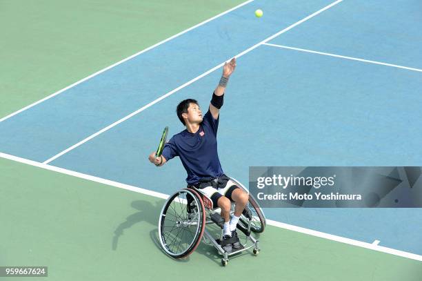 Shingo Kunieda of Japan plays serves during the Men's Singles semi final against Gustavo Fernandez of Argentina on day four of the Wheelchair Tennis...