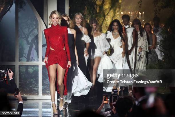 Models Hailey Clauson, Nadine Leopold, Toni Garrn, Maryna Linchuk, Shanina Shaik, Maria Borges, Vanessa Moody and Lara Leito on stage at the amfAR...