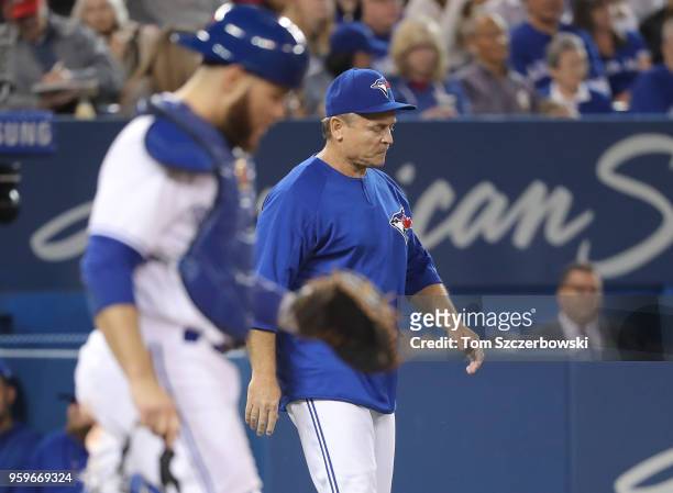 John Gibbons of the Toronto Blue Jays comes out of the dugout to make the second pitching change of the fifth inning of Seunghwan Oh during MLB game...