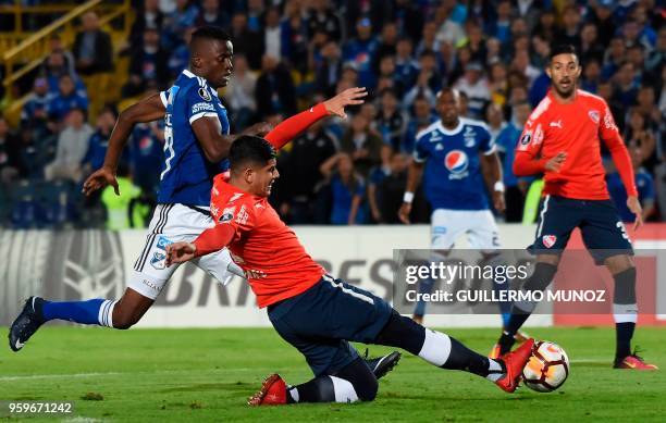 Argentina's Independiente player Alan Franco vies for the ball with Colombian Millonarios Jader Valencia players during their Copa Libertadores...