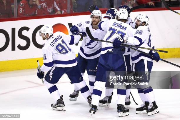 Steven Stamkos of the Tampa Bay Lightning celebrates with his teammates after scoring a goal against Braden Holtby of the Washington Capitals during...