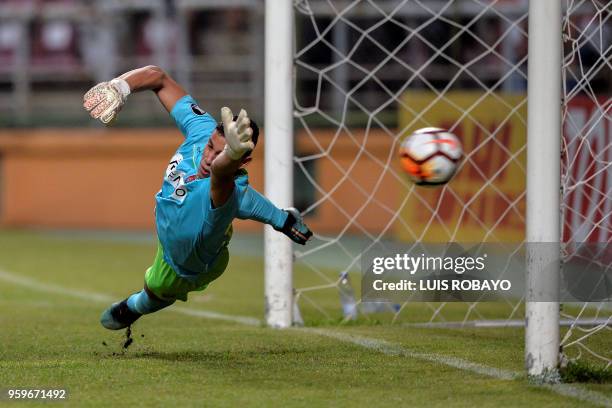 Venezuela's Deportivo Lara goalkeeper Luis Curiel fails to stop a shot by Brazil's Corinthians midfielder Jadson , during their Copa Libertadores...