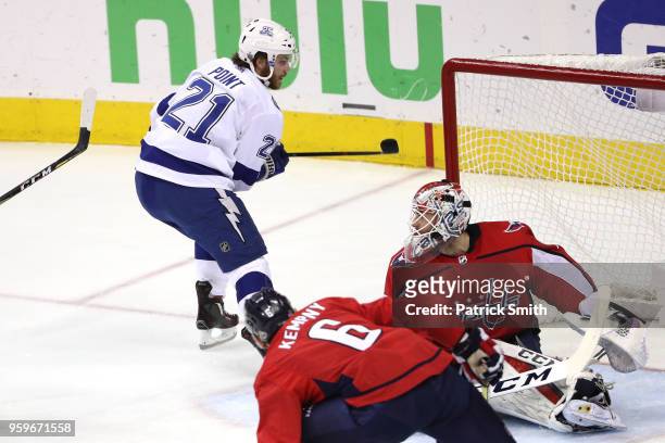 Brayden Point of the Tampa Bay Lightning scores a goal on Braden Holtby of the Washington Capitals during the first period in Game Four of the...