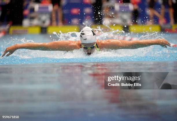 Allison Schmitt competes in the women's 100 meter butterfly final during the TYR Pro Swim Series at Indiana University Natatorium on May 17, 2018 in...