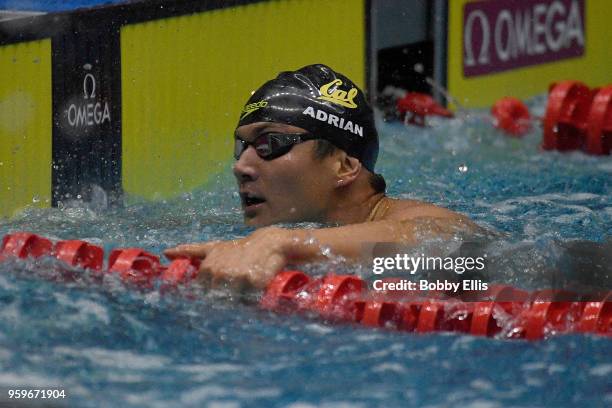 Nathan Adrian catches his breath after winning the men's 100 meter freestyle final at at the TYR Pro Swim Series at Indiana University Natatorium on...