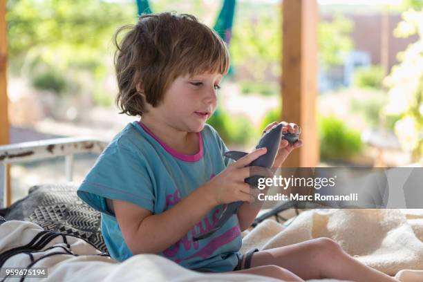 4 year old boy playing with toy shark - lamy new mexico stock pictures, royalty-free photos & images