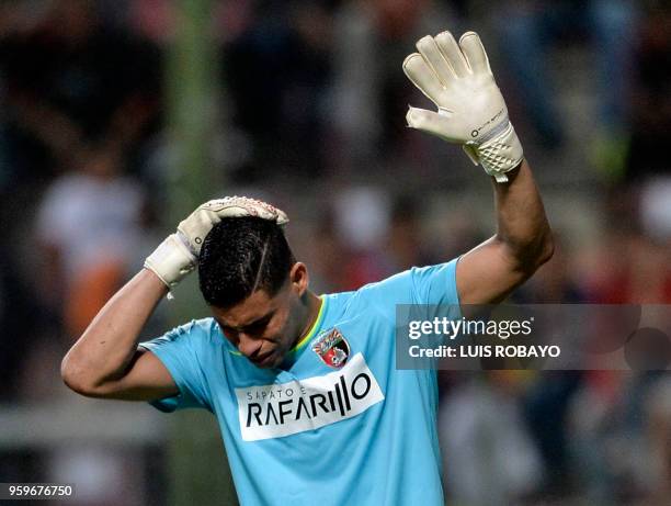 Venezuela's Deportivo Lara goalkeeper Luis Curiel reacts a Lara fans throw objects to the field during their Copa Libertadores football match against...