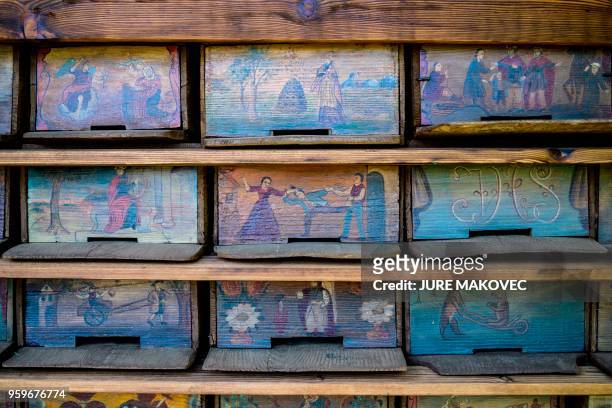This picture taken on May 7, 2018 in Breznica, Slovenia shows a detail of a painted beehive panel on Anton Jansa's memorial apiary. - Anton Jana was...