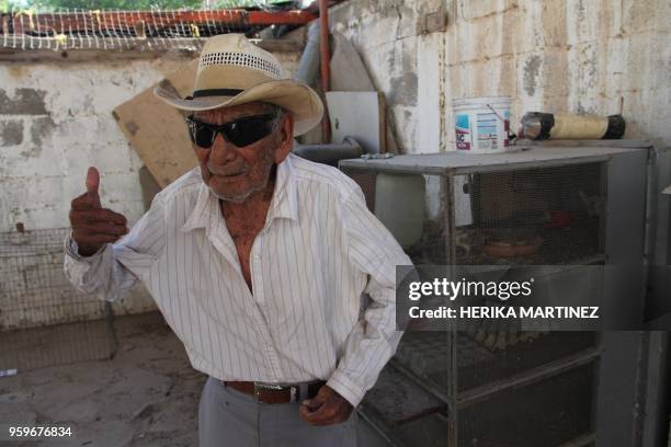 Mexican Manuel Garcia Hernandez, who claims to be 121 years old, poses for a picture at his home in Ciudad Juarez, Chihuahua state, Mexico on May 16,...