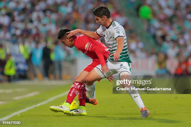 Jesus Angulo of Santos and Leonel Lopez of Toluca fight for the ball during the Final first leg match between Santos Laguna and Toluca as part of the...