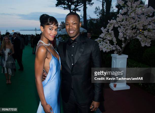 Laura Harrier and Corey Hawkins attend the cocktail at the amfAR Gala Cannes 2018 at Hotel du Cap-Eden-Roc on May 17, 2018 in Cap d'Antibes, France.