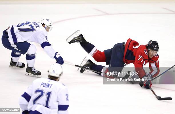 Oshie of the Washington Capitals falls to the ice against Yanni Gourde of the Tampa Bay Lightning during the second period in Game Four of the...