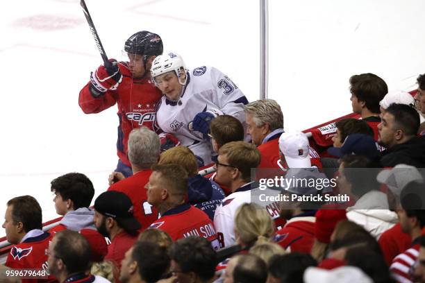 Jakub Vrana of the Washington Capitals checks Yanni Gourde of the Tampa Bay Lightning during the second period in Game Four of the Eastern Conference...