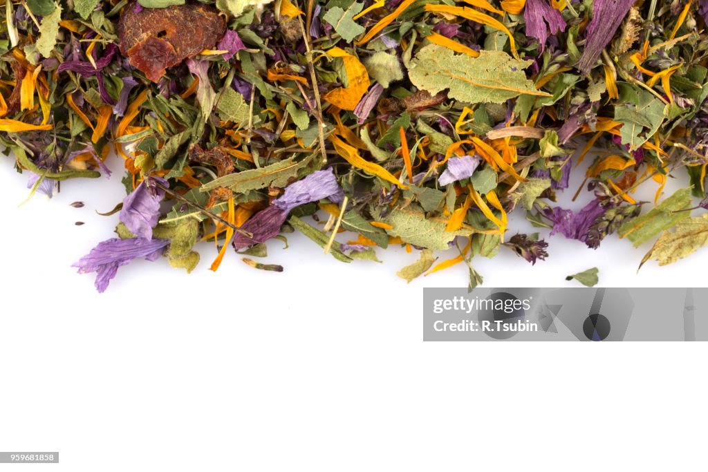 Dried herbal flower tea leaves over white background