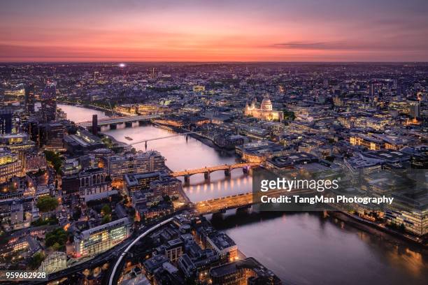 aerial view of london cityscape with river thames at twilight - aerial view london stock-fotos und bilder