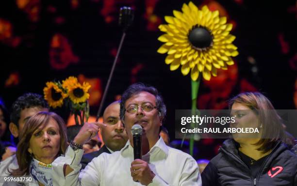 Colombian presidential candidate Gustavo Petro , from Colombia Humana party, speaks to supporters next to his wife Veronica Alcocer Garcia , during a...