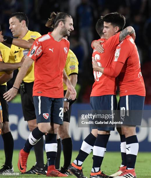 Gaston Silva,Fabricio Bustos and Fernando Gaibor of Independiente celebrate after a match between Millonarios and Independiente as part of Copa...