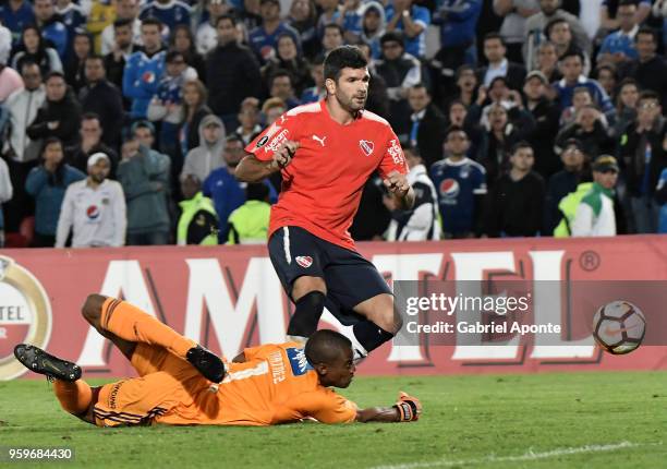 Wuilker Fariñez goalkeeper of Millonarios dives for the ball during a match between Millonarios and Independiente as part of Copa CONMEBOL...