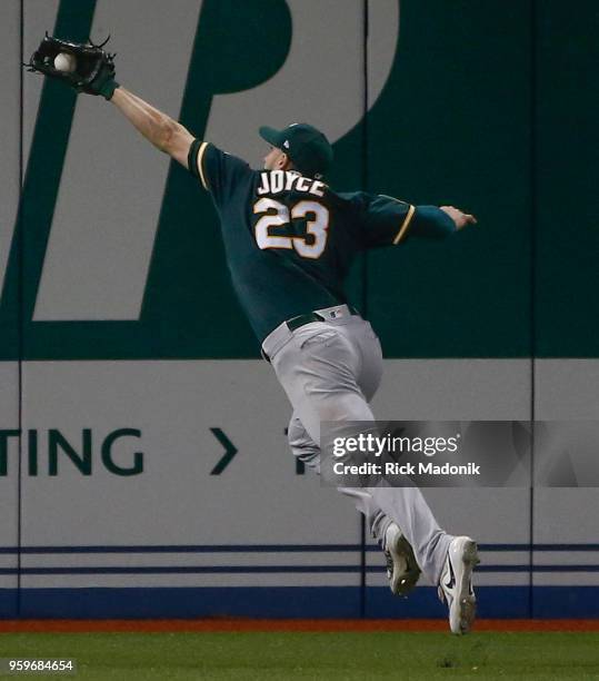 Oakland Athletics left fielder Matt Joyce makes a nice catch to rob Kendrys Morales of a hit. Toronto Blue Jays Vs Oakland Athletics in MLB regular...