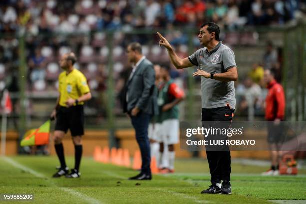 Brazil's Corinthians coach Fabio Carille gives instructions to his players during their Copa Libertadores football match against Venezuela's...