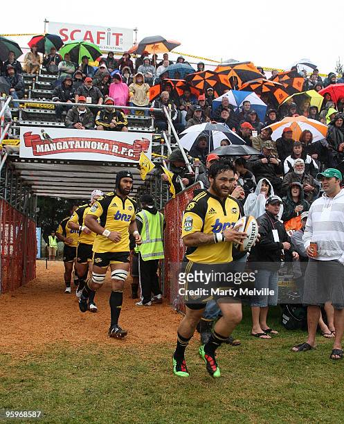 Piri Weepu captain of the Hurricanes leads his team out onto the field during a Super 14 Trial match between the Hurricanes and the Blues at...
