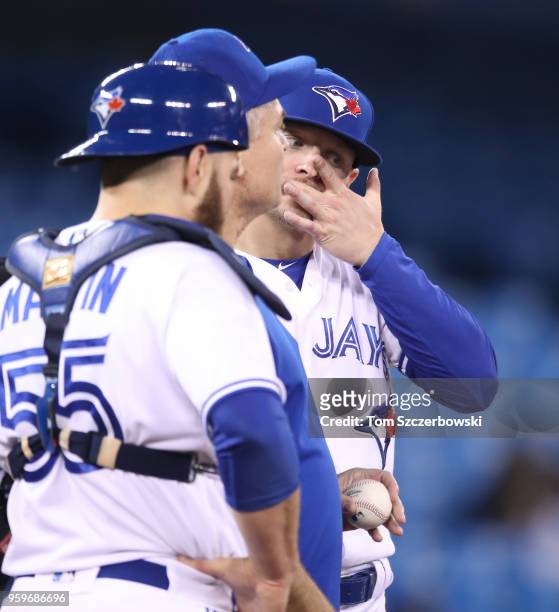 Josh Donaldson of the Toronto Blue Jays reacts as manager John Gibbons comes out to make a pitching change in the fifth inning during MLB game action...