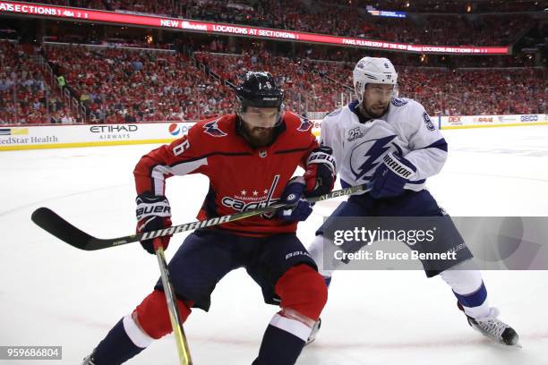 Michal Kempny of the Washington Capitals collides with Tyler Johnson of the Tampa Bay Lightning during the first period in Game Four of the Eastern...