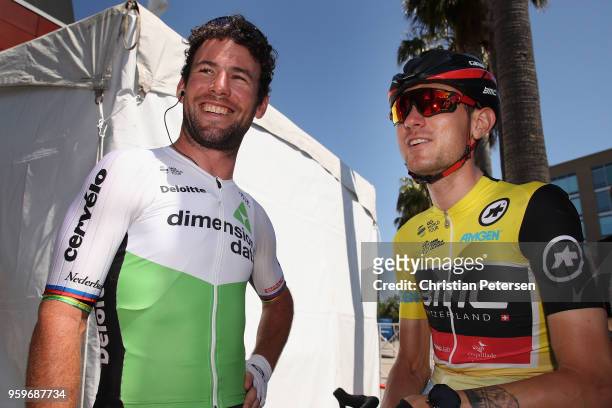 Mark Cavendish of Great Britain riding for Team Dimension Data talks with Tejay van Garderen of The United States and BMC Racing Team in the yellow...