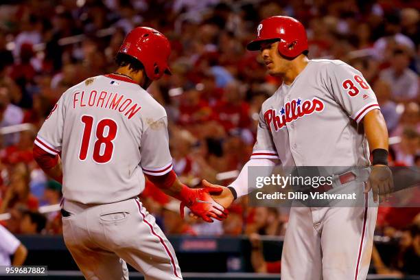 Pedro Florimon and Jorge Alfaro of the the Philadelphia Phillies celebrate after scoring runs against the St. Louis Cardinals in the eighth inning at...