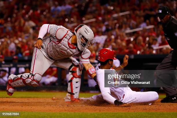 Jorge Alfaro of the the Philadelphia Phillies tags out Jose Martinez of the St. Louis Cardinals in the eighth inning at Busch Stadium on May 17, 2018...